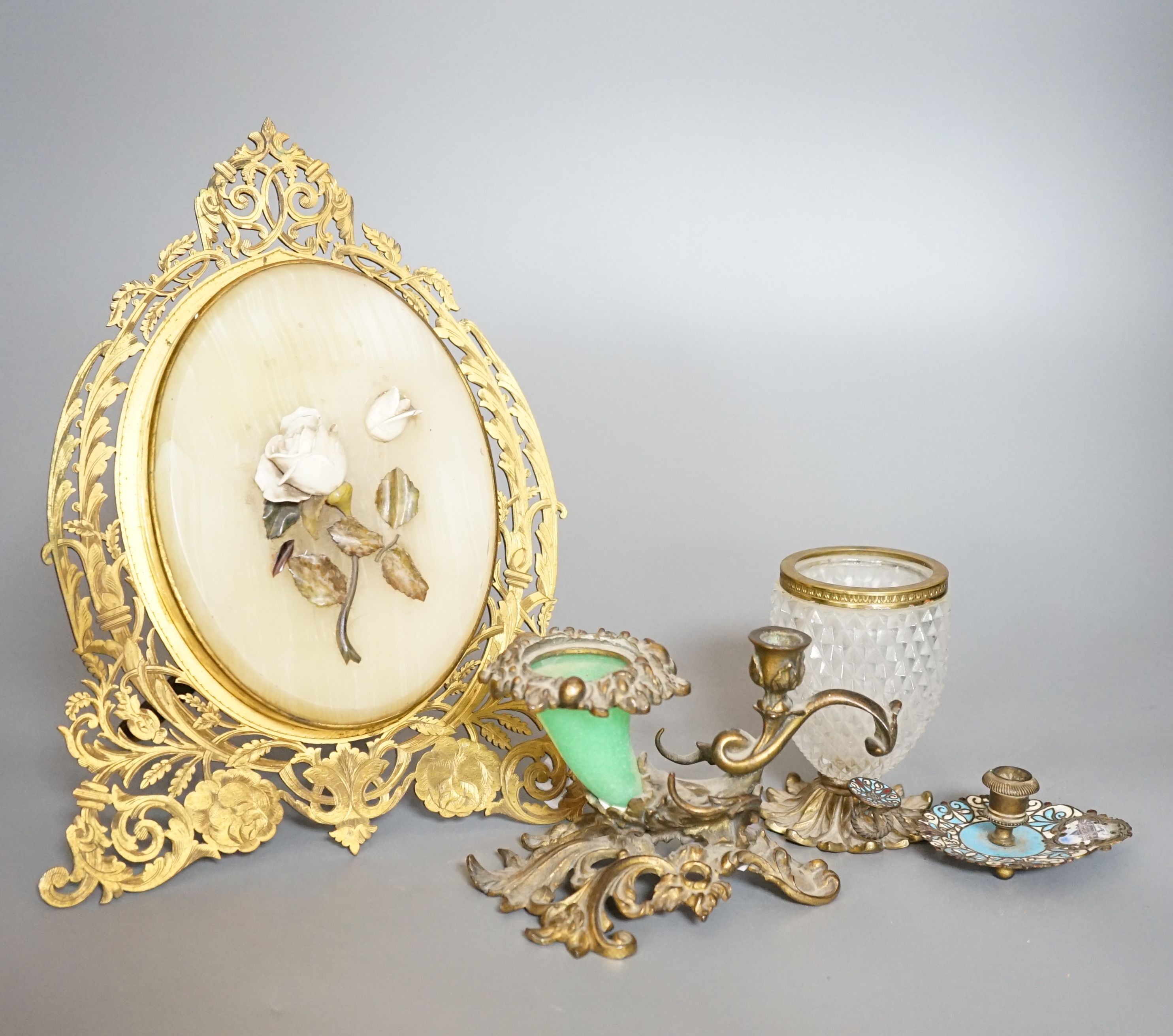 An ormolu and hardstone mounted easel double photo frame, a glass and brass chamberstick, a Venice enamel chamberstick etc.